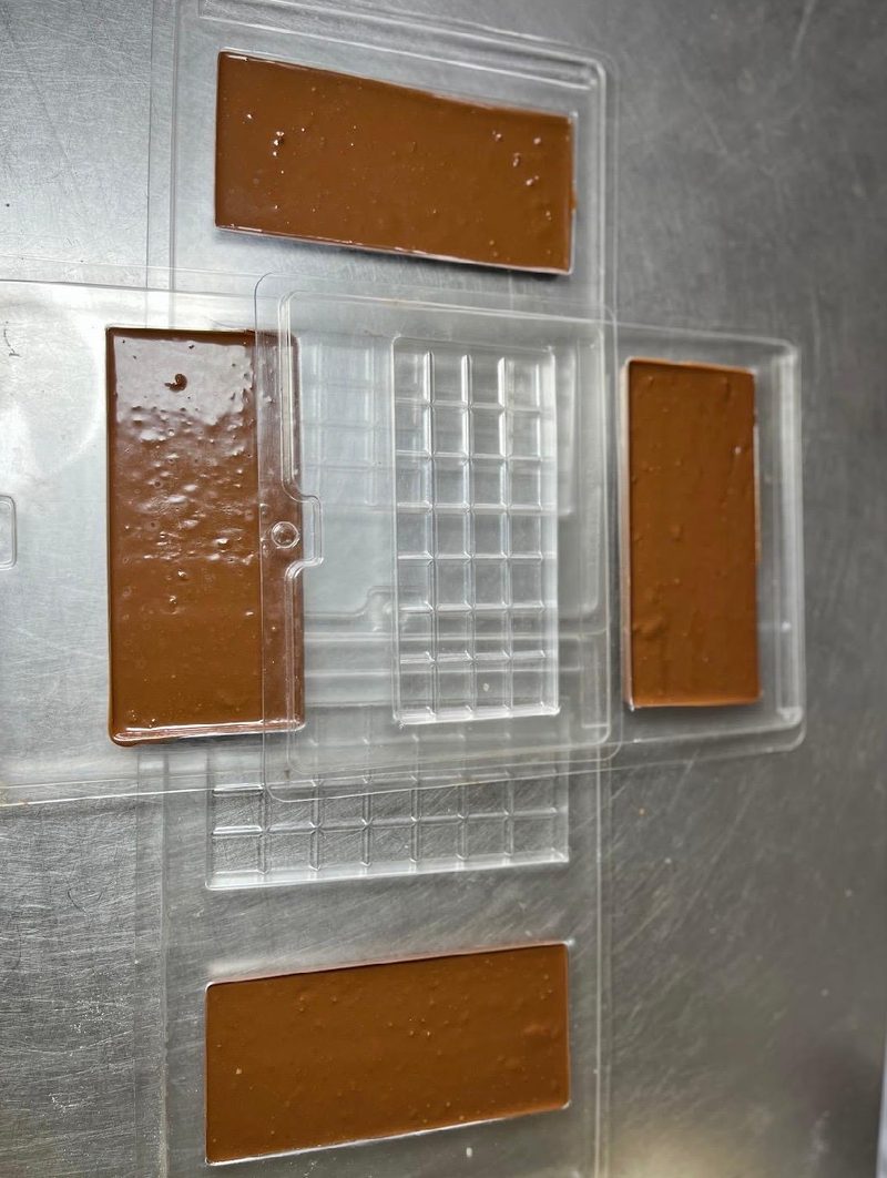 Melted chocolate poured into bar moulds